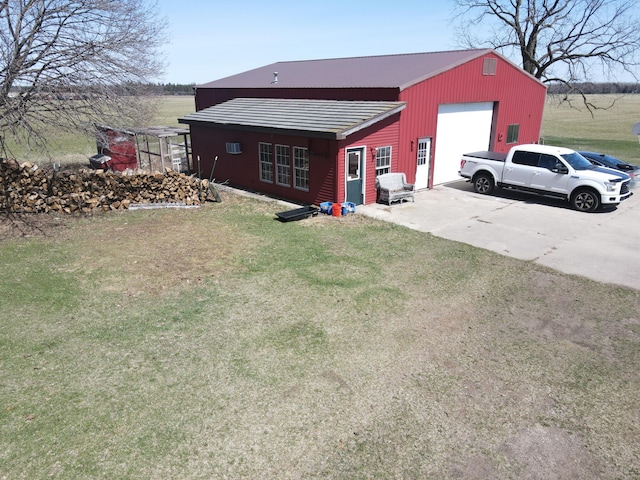 view of outbuilding with concrete driveway