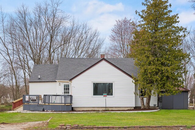 18125 174th Ave, Spring Lake, MI 49456 - rear view of property with a lawn, a chimney, roof with shingles, and a deck