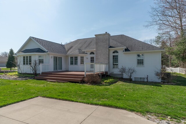 1060 Briarwood Ct, Norton Shores, MI 49441 - rear view of property featuring a wooden deck, roof with shingles, and a yard