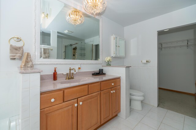 1060 Briarwood Ct, Norton Shores, MI 49441 - full bath with a shower stall, vanity, a chandelier, and toilet