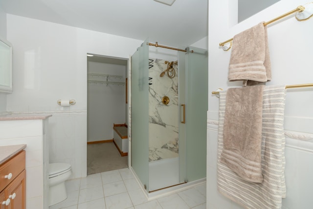 1060 Briarwood Ct, Norton Shores, MI 49441 - full bathroom featuring a shower stall, toilet, vanity, and tile patterned floors
