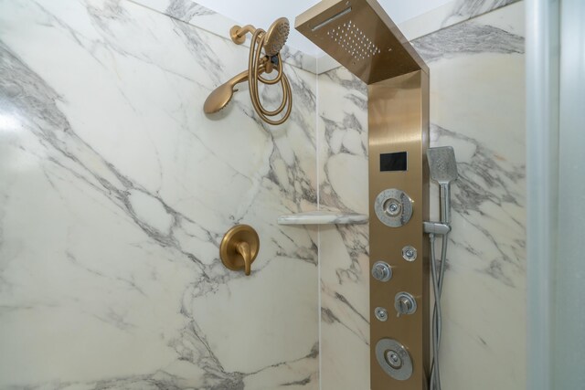 1060 Briarwood Ct, Norton Shores, MI 49441 - bathroom featuring a marble finish shower