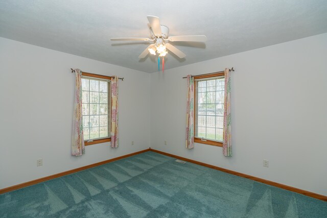 1060 Briarwood Ct, Norton Shores, MI 49441 - empty room featuring a wealth of natural light, a ceiling fan, and carpet flooring