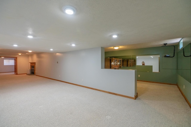 1060 Briarwood Ct, Norton Shores, MI 49441 - finished basement featuring light carpet, baseboards, and recessed lighting