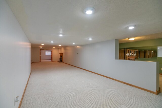 1060 Briarwood Ct, Norton Shores, MI 49441 - finished below grade area with recessed lighting, carpet, and baseboards