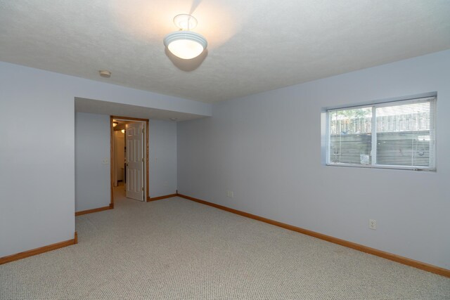 1060 Briarwood Ct, Norton Shores, MI 49441 - unfurnished room with baseboards and light colored carpet