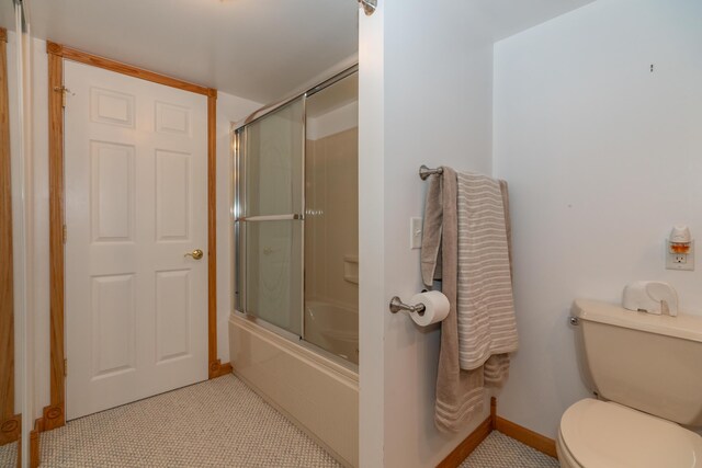 1060 Briarwood Ct, Norton Shores, MI 49441 - full bathroom with combined bath / shower with glass door, toilet, and baseboards