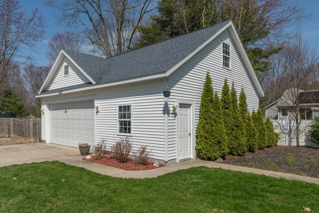1060 Briarwood Ct, Norton Shores, MI 49441 - garage with driveway and fence