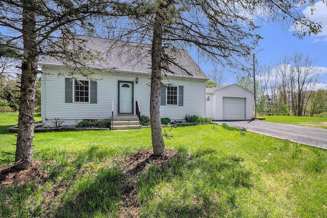 3175 Kalmbach Rd, Grass Lake, MI 49240 - view of front facade featuring an outdoor structure, driveway, a garage, a front yard, and roof with shingles