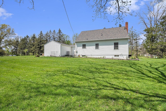 3175 Kalmbach Rd, Grass Lake, MI 49240 - back of house featuring a chimney and a yard