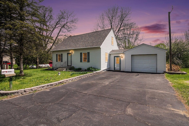 3175 Kalmbach Rd, Grass Lake, MI 49240 - view of front of property featuring driveway, an attached garage, roof with shingles, and a yard