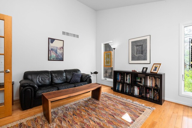 4138 W Loch Alpine Dr, Ann Arbor, MI 48103 - living area with wood-type flooring and baseboards