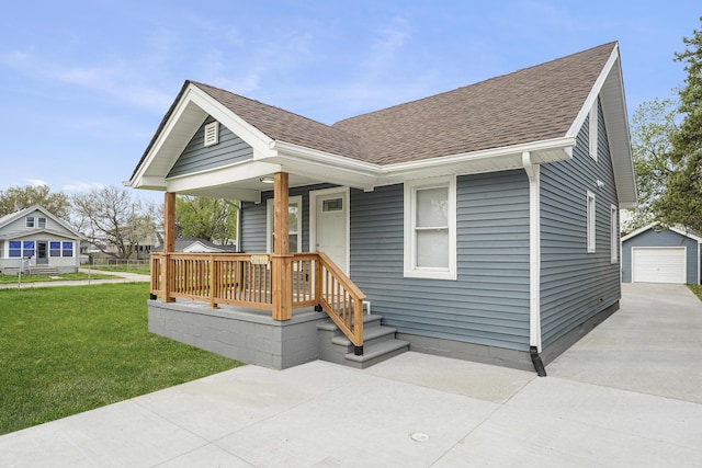 21611 Conners Ave, Warren, MI 48091 - bungalow-style home with a front lawn, roof with shingles, concrete driveway, a porch, and a detached garage