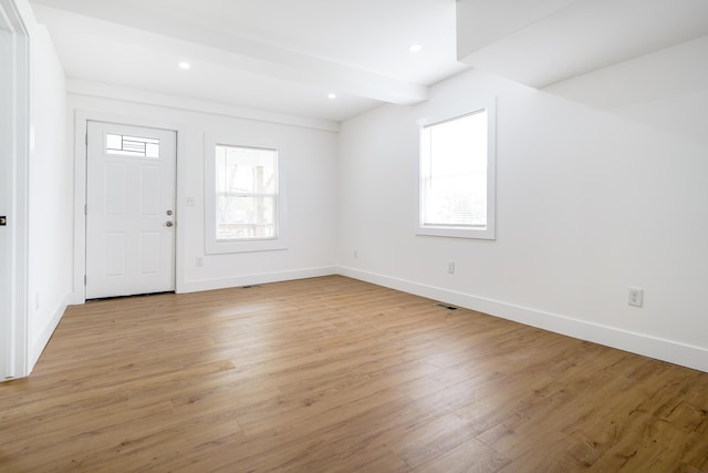 21611 Conners Ave, Warren, MI 48091 - entryway featuring baseboards, light wood-style flooring, and beam ceiling