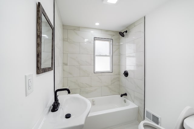 21611 Conners Ave, Warren, MI 48091 - bathroom featuring toilet, shower / washtub combination, a sink, and visible vents