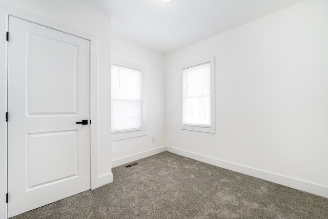 21611 Conners Ave, Warren, MI 48091 - unfurnished room featuring baseboards, carpet, and visible vents