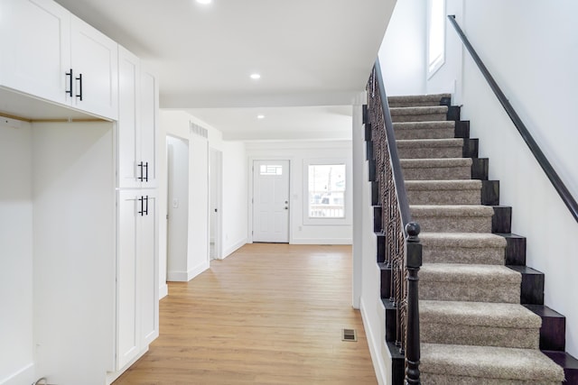 21611 Conners Ave, Warren, MI 48091 - stairs featuring recessed lighting, baseboards, wood finished floors, and visible vents