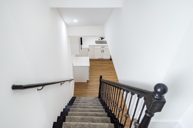 21611 Conners Ave, Warren, MI 48091 - stairs featuring recessed lighting and wood finished floors