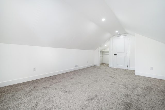 21611 Conners Ave, Warren, MI 48091 - additional living space featuring light carpet, recessed lighting, baseboards, lofted ceiling, and visible vents