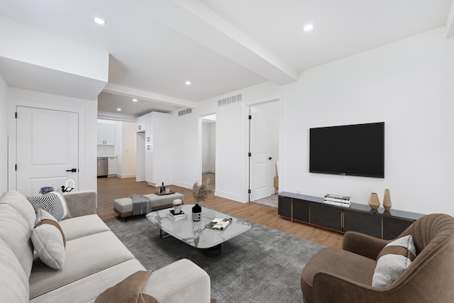 21611 Conners Ave, Warren, MI 48091 - living area with light wood-style flooring, recessed lighting, baseboards, beamed ceiling, and visible vents