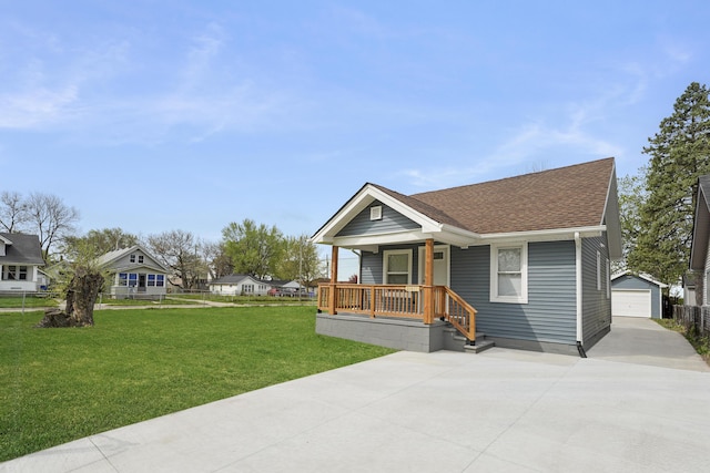 21611 Conners Ave, Warren, MI 48091 - bungalow-style house featuring a porch, a front yard, an outbuilding, a detached garage, and concrete driveway