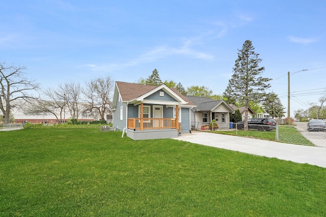 21611 Conners Ave, Warren, MI 48091 - bungalow-style house featuring fence, driveway, a porch, and a front lawn