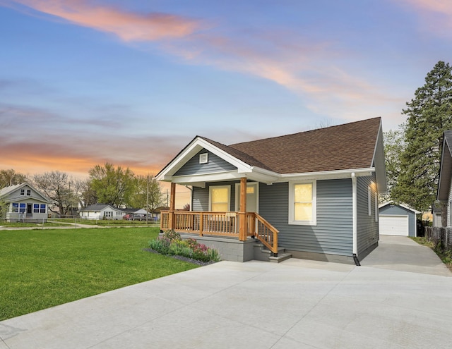 21611 Conners Ave, Warren, MI 48091 - bungalow-style home featuring a porch, a yard, a detached garage, an outdoor structure, and concrete driveway