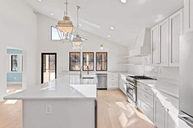kitchen with open shelves, a sink, stainless steel appliances, custom range hood, and recessed lighting
