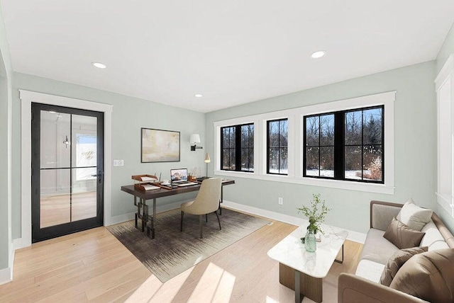 office with baseboards, recessed lighting, and light wood-style floors