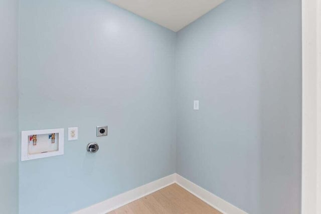 laundry area with light wood-type flooring, baseboards, washer hookup, electric dryer hookup, and laundry area