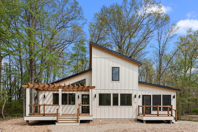 20 Walden Way, New Buffalo, MI 49117 - rear view of house featuring a pergola, board and batten siding, and a deck
