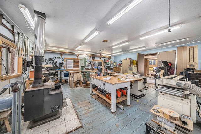 11365 Phal Rd, Grass Lake, MI 49240 - misc room with a textured ceiling, a workshop area, and wood-type flooring