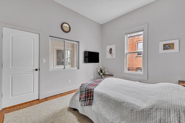 113 S Fourth Ave Unit 6, Ann Arbor, MI 48104 - bedroom with wood finished floors and baseboards