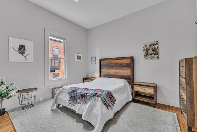 113 S Fourth Ave Unit 6, Ann Arbor, MI 48104 - bedroom featuring wood finished floors and baseboards