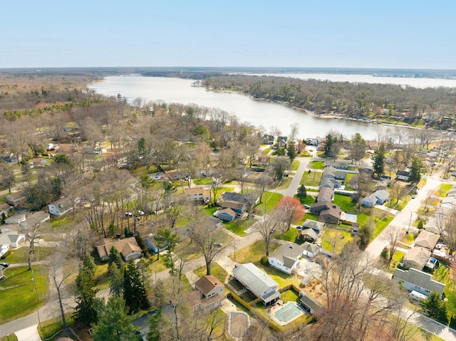 drone / aerial view featuring a water view and a residential view