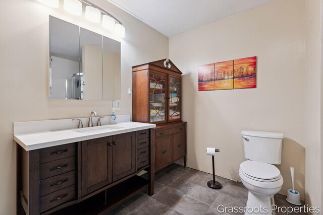 bathroom with toilet and vanity
