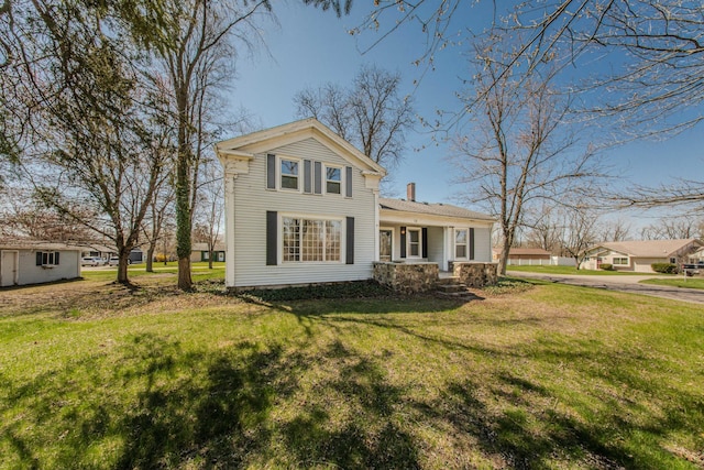 exterior space featuring a lawn and a chimney
