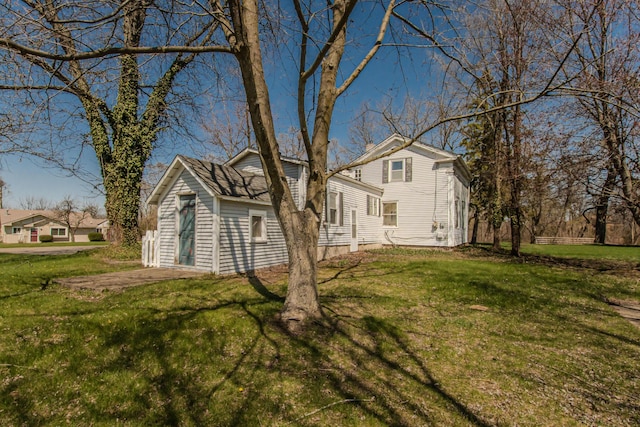 view of side of property featuring a yard