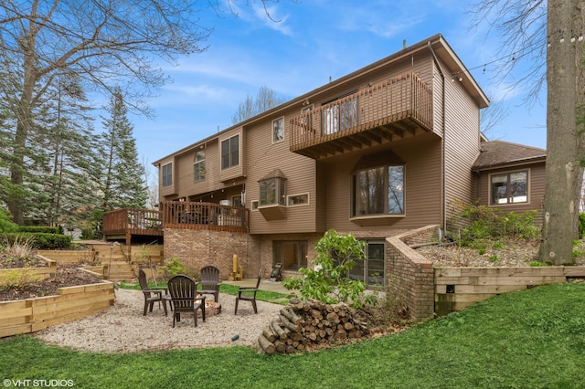 1888 Boardwalk, Saint Joseph, MI 49085 - back of house with brick siding, a patio, a yard, and a balcony