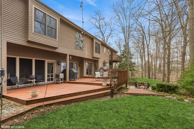 1888 Boardwalk, Saint Joseph, MI 49085 - rear view of property featuring a lawn and a deck