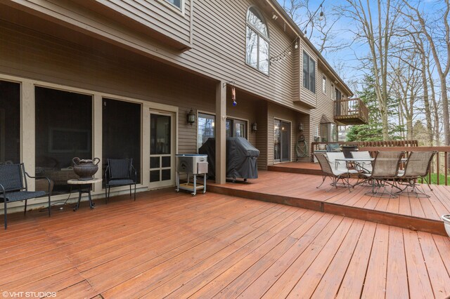 1888 Boardwalk, Saint Joseph, MI 49085 - wooden terrace featuring outdoor dining area and a grill