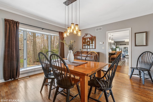1888 Boardwalk, Saint Joseph, MI 49085 - dining space featuring wood-type flooring, an inviting chandelier, visible vents, and plenty of natural light
