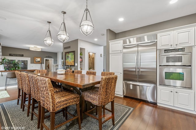 1888 Boardwalk, Saint Joseph, MI 49085 - dining room featuring visible vents, recessed lighting, a chandelier, and dark wood-style flooring