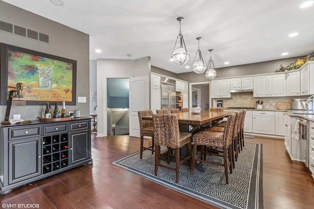 1888 Boardwalk, Saint Joseph, MI 49085 - dining room featuring recessed lighting, visible vents, dark wood-style floors, and an inviting chandelier