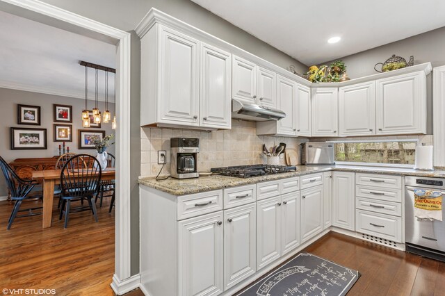 1888 Boardwalk, Saint Joseph, MI 49085 - kitchen featuring decorative backsplash, gas cooktop, dark wood-type flooring, and white cabinetry