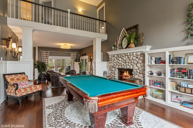 1888 Boardwalk, Saint Joseph, MI 49085 - game room featuring wood finished floors, a towering ceiling, a fireplace, and billiards