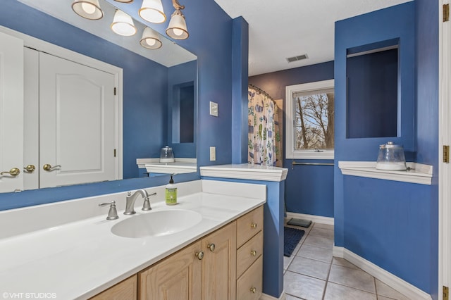 1888 Boardwalk, Saint Joseph, MI 49085 - bathroom featuring vanity, baseboards, tile patterned flooring, and visible vents