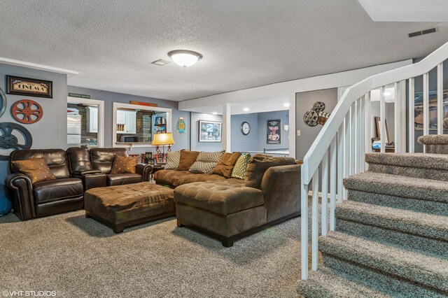 1888 Boardwalk, Saint Joseph, MI 49085 - living area with a textured ceiling, visible vents, carpet flooring, and stairs