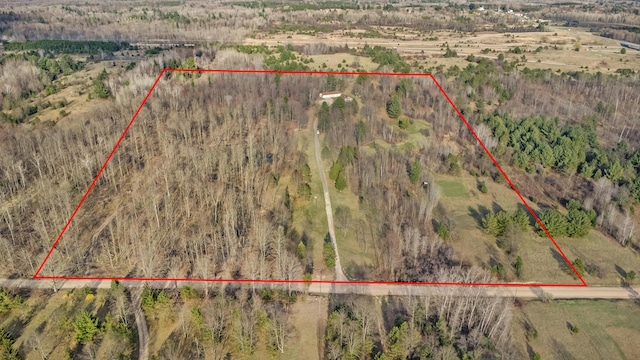 birds eye view of property with a rural view