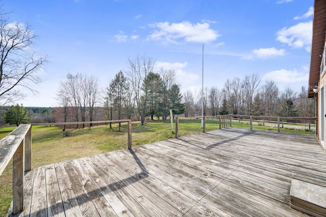 wooden deck with a lawn
